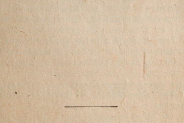 Close-up of textured beige paper with subtle markings and a thin black horizontal line across the...