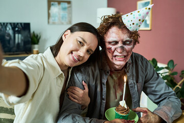 Young Wife Taking Selfie With Her Zombie Husband On His Birthday