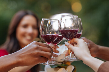 Close up of four glasses with red wine in them