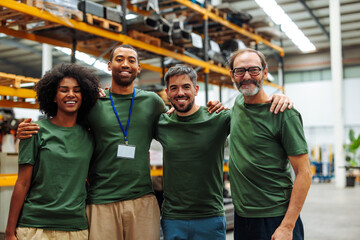 Warehouse workers smiling and embracing teamwork in distribution center