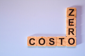 words with wooden letters, zero cost, on colored background