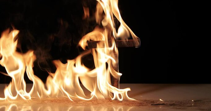 Fire around a burning cross symbol