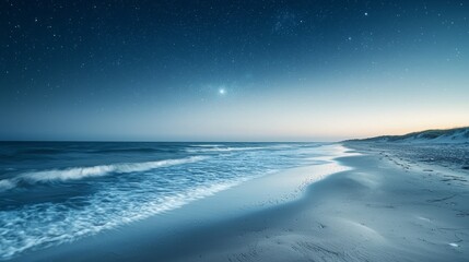 Stretched across the horizon, gentle waves kiss the sandy beach under a captivating twilight sky. Stars twinkle above, creating a peaceful atmosphere as day turns to night