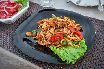Traditional uzbek lagman on a plate