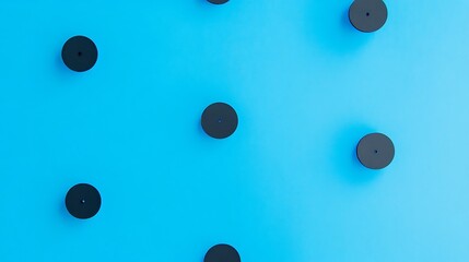 Black disks blue background