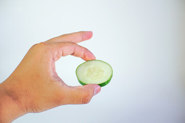 male hand hold cucumber, isolated on white background
