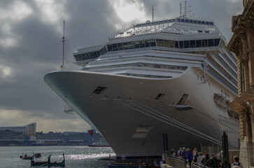 Gigantic cruiseship cruise ship liner Fascinosa docked at pier terminal in old town Valletta, Malta...