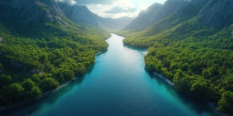 Fototapeta premium Serene River Valley: A Breathtaking Aerial View of Lush Green Mountains and Turquoise Waters