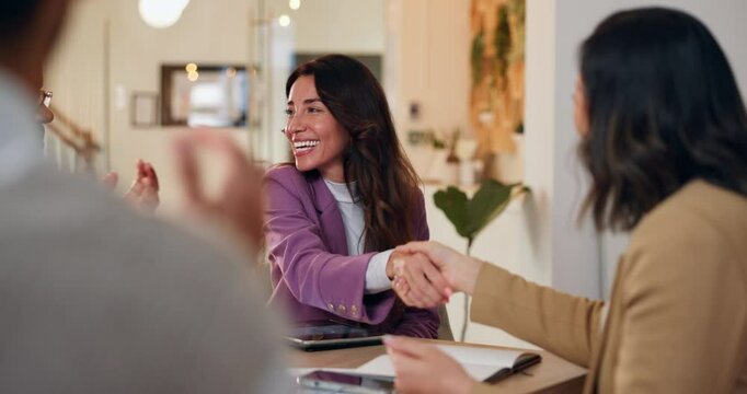 Meeting, shaking hands and business people in office for discussion, deal or offer on project. Collaboration, partnership and public relations team with client for handshake with multimedia contract.