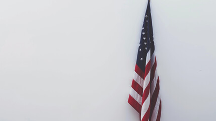 American flag draped on a white wall.