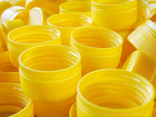 yellow plastic bottle caps.Recycling collection and production processing plastic bottle caps...