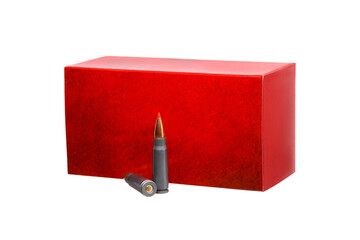 Red ammunition box with two rifle cartridges standing in front of it, isolated on a white...