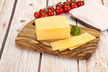 Yellow cheese piece with slices