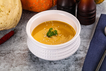 Vegan pumpkin cream soup served sesam