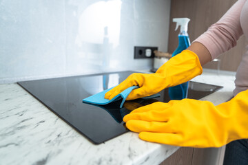 A Housewife Cleaning the Stove: A Reflection of Cleanliness and Care