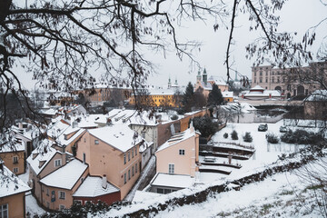 Novy svet on Hradcany in Prague covered by snow during Christmas with gardens, trees,monastery, churches and old historical palaces creates wonderful peaceful and cozy atmosphere of czech capital