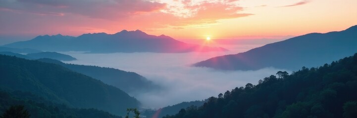 Obraz premium Misty mountains shrouded in cloud veils at sunrise, mist, scenery, mountains