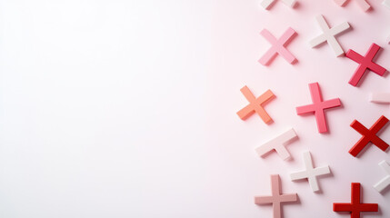 Fototapeta premium Colorful crosses scattered on minimalistic background create playful and artistic vibe