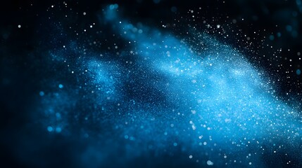 Fototapeta premium Vibrant blue powder explosion on a black background 