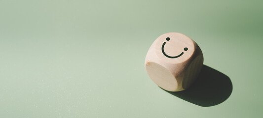 Wood cube with smile icon, World mental health day or feedback rating concept, Positive customer...