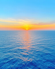 Fototapeta premium vast ocean horizon glowing in warm golden hues at sunset