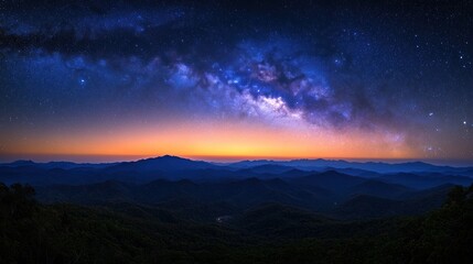 Majestic Milky Way over mountain range at sunrise.
