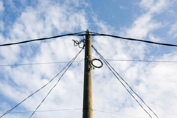 Electric tower with long cables on the right and left sides
