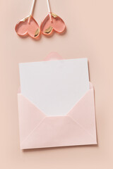 Valentine's day greeting card with blank, envelope and two pink lollipops sweets on pink...