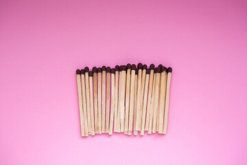 Matches on a pink background. There is a space for the text.
