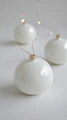 White ceramic Christmas ornaments, string lights, minimalist background, holiday decoration