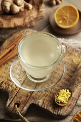 Herbal tea made of fresh ginger root with cinnamon sticks and lemon