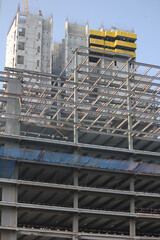 construction high rise building  site with crane