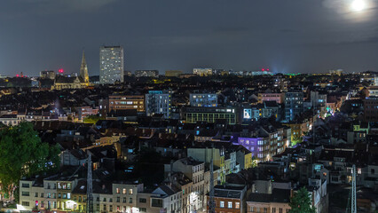 Aerial night timelapse panorama over Brussels skyline in Schaerbeek with Saint-Servais Church