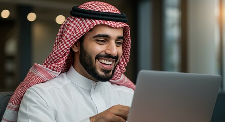 Smart and safe electronic marketing through social media, browsing the Internet and working remotely via a laptop, a close-up portrait of a smiling Saudi Gulf Arab young man wearing a traditional thob