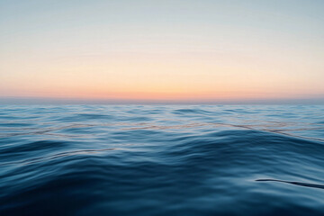 Obraz premium Sunset over calm ocean waters creates a serene atmosphere with vibrant colors on the horizon