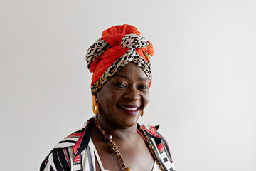 Beautiful woman in African clothes happy on a white background. Smiling, serious. Rio de Janeiro,...