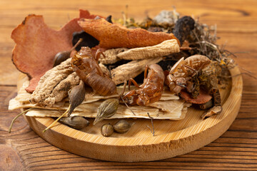 angle view Chinese herb medicine on a bamboo dish at horizontal composition