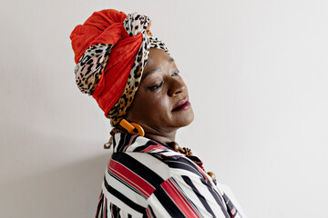Beautiful woman in African clothes happy on a white background. Smiling, serious. Rio de Janeiro,...