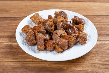 angle view homemade beef dices on a dish
