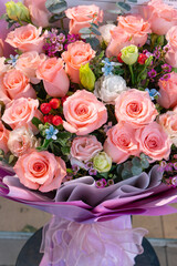 bunch of pink roses as present on sale at vertical composition