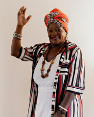 Beautiful woman in African clothes happy on a white background. Smiling, serious. Rio de Janeiro,...