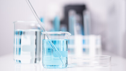Laboratory beaker blue liquid chemistry chemical research science medical equipment