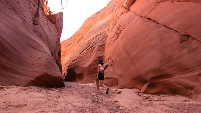 A tranquil hike in Antelope Canyon reveals otherworldly sandstone walls sculpted by millennia of natural forces and winds.