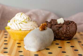 Wooden tray with three types of sweets on it. Traditional sweet sold in the city of Pelotas, Rio Grande do Sul, Brazil. Delicious dessert.