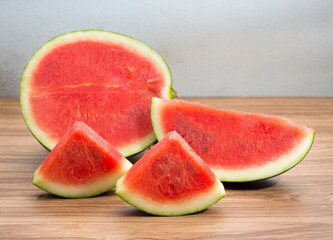 Fresh sliced watermelon on brown wooden table