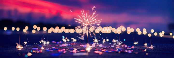 Obraz premium Festive Sparkler Fireworks Night Celebration Bokeh Lights