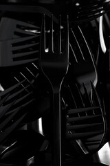 plastic disposable cutlery - black forks. lunch
environmental problem
