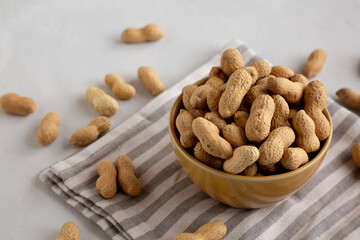 Organic Raw Peanuts in a Bowl, side view.