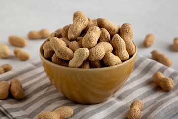 Organic Raw Peanuts in a Bowl, low angle view.