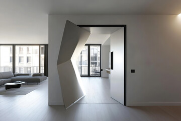 Fototapeta premium Intriguing space door design opens into modern apartment with sleek architecture